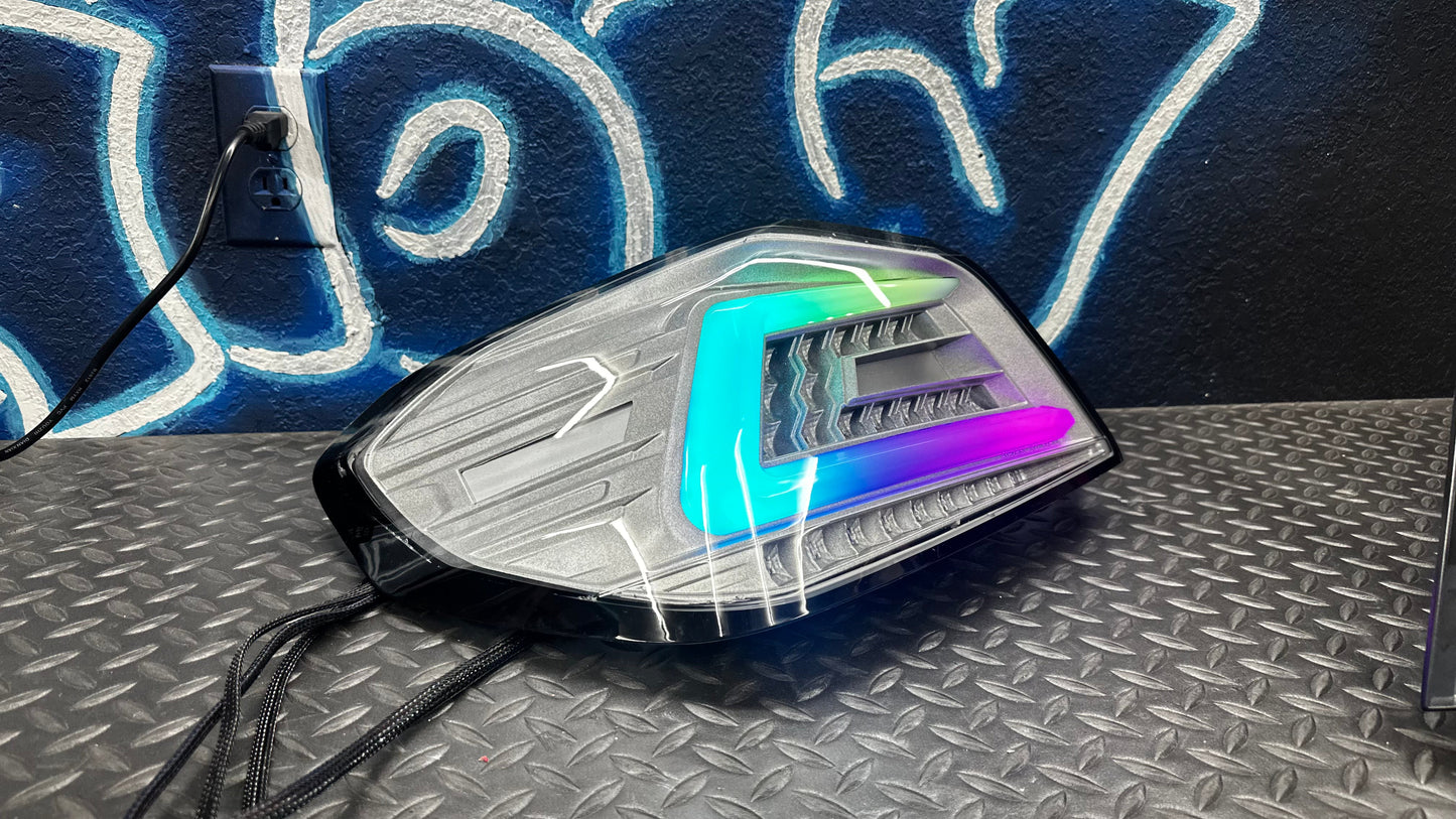 NTXGlow clear RGB color-shifting tail lights for 2015-2021 Subaru WRX/STI, shown installed on the vehicle.