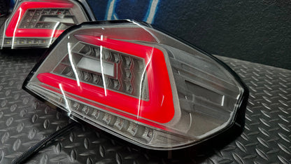 NTXGlow clear RGB color-shifting tail lights for 2015-2021 Subaru WRX and STI, featuring vibrant lighting and sleek design.