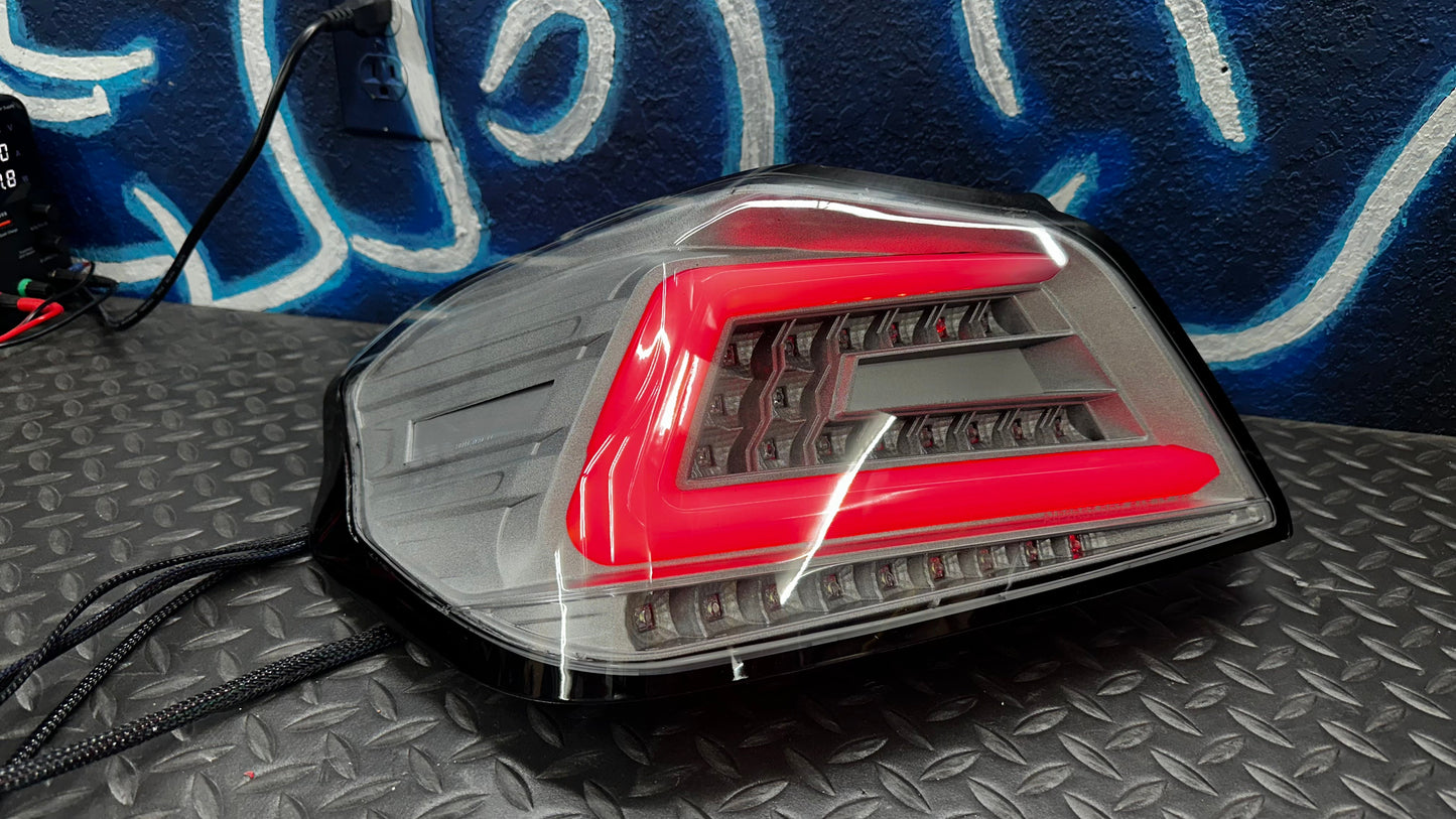 NTXGlow clear RGB color-shifting tail lights for 2015-2021 Subaru WRX/STI, with sleek design and vibrant lighting.