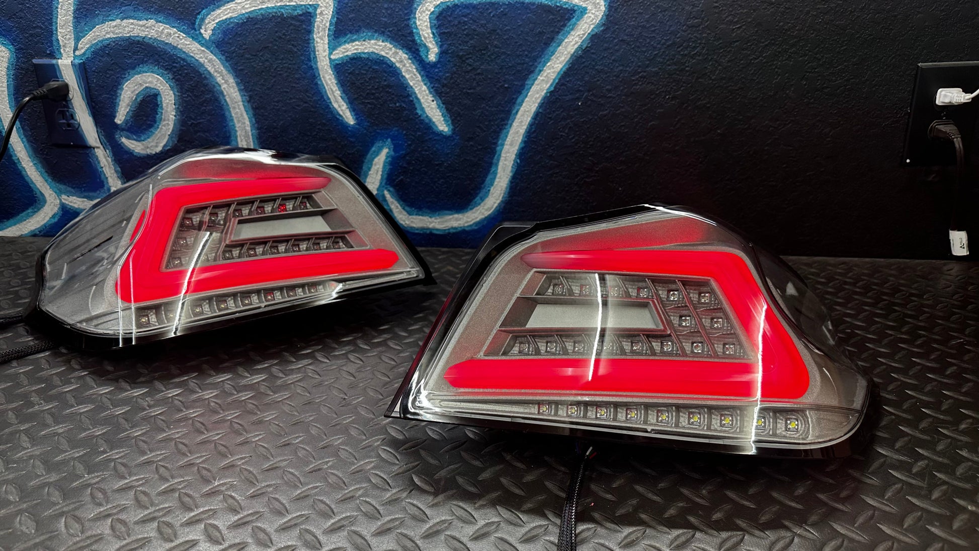 NTXGlow clear RGB color-shifting tail lights for 2015-2021 Subaru WRX/STI, shown on a car with the lights illuminated.