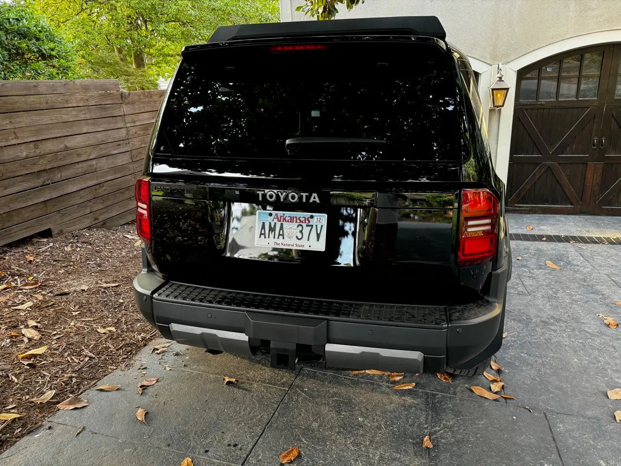 Toyota Land Cruiser 2024+ rear tailgate emblem overlays by StickerFab, sleek metal emblems for authentic vehicle branding.