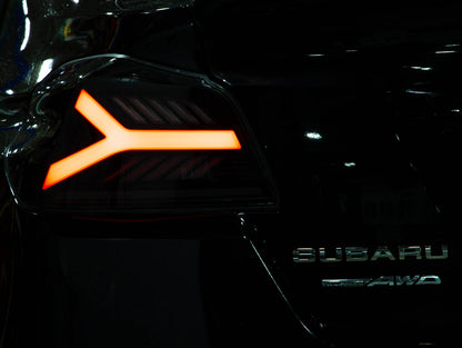 OLM Y-Spec LED taillights with smoke lens and RGB optic for Subaru WRX/STI 2015-2021, showing illuminated tail light design