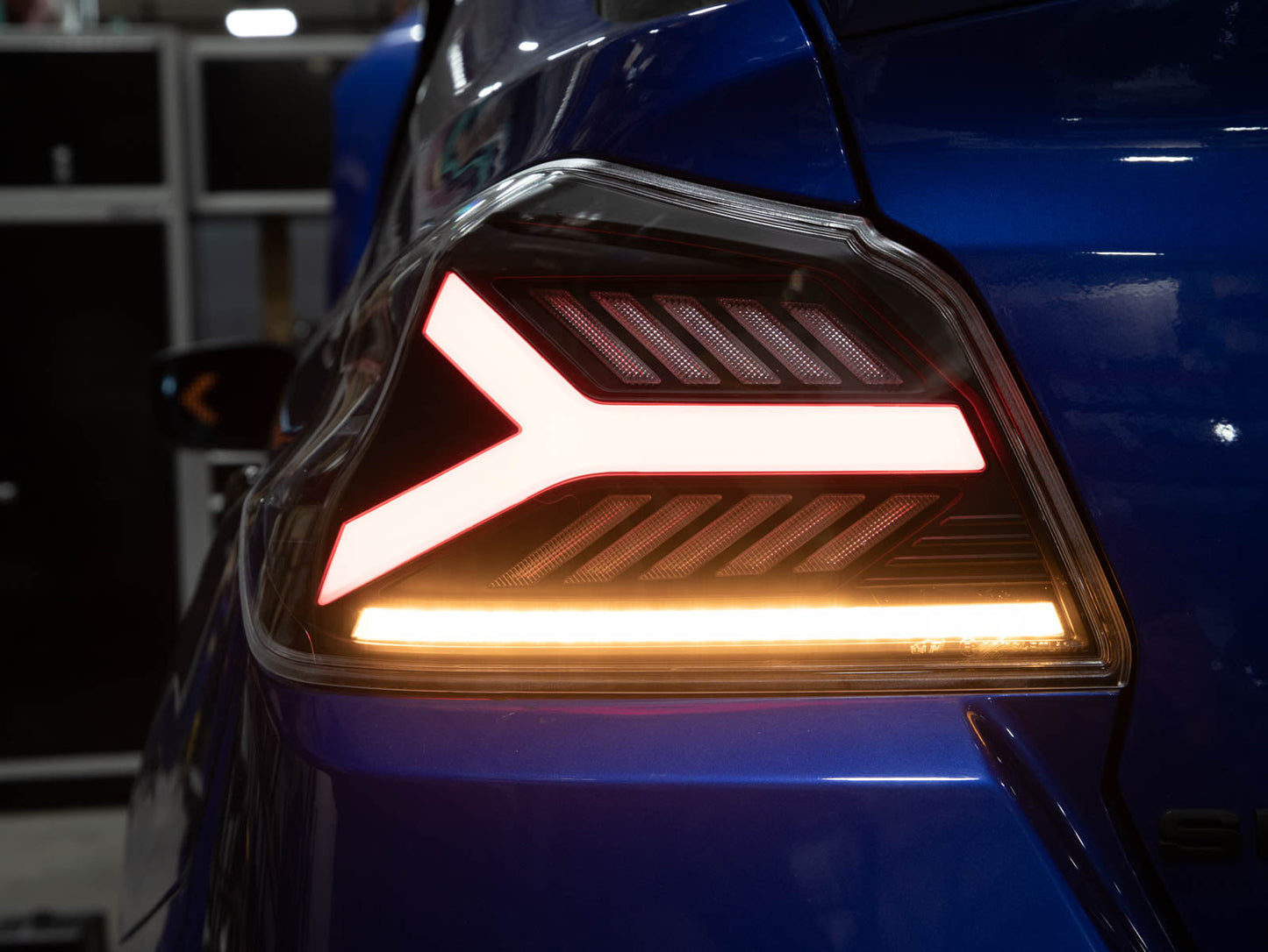 OLM Y-Spec LED taillights with smoke lens and RGB optic for Subaru WRX/STI 2015-2021, showing sleek tail light design.