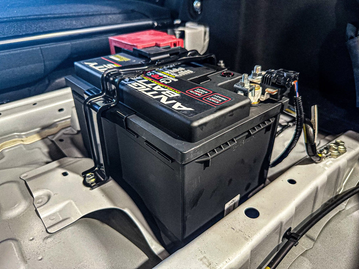 2023 GR Corolla Lithium Performance Battery by MeLe Design Firm, compact automotive battery with black casing and terminal connections.