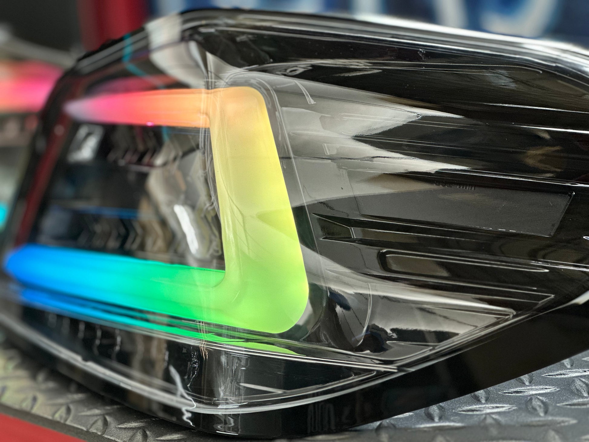NTXGlow black RGB color-shifting tail lights for 2015-2021 WRX and STI, featuring sleek design and dynamic lighting effects