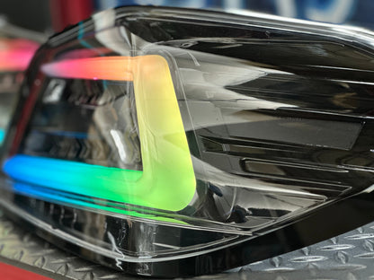 NTXGlow black RGB color-shifting tail lights for 2015-2021 WRX and STI, featuring sleek design and dynamic lighting effects