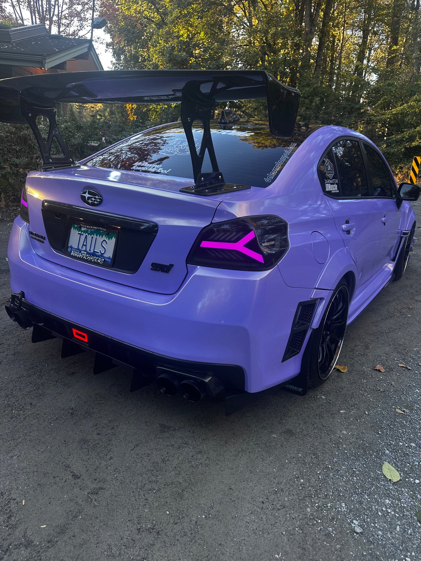 OLM Y-Spec LED taillights for 2015-2021 Subaru WRX/STI with smoke lens and RGB optic, showing sleek vehicle rear lighting.
