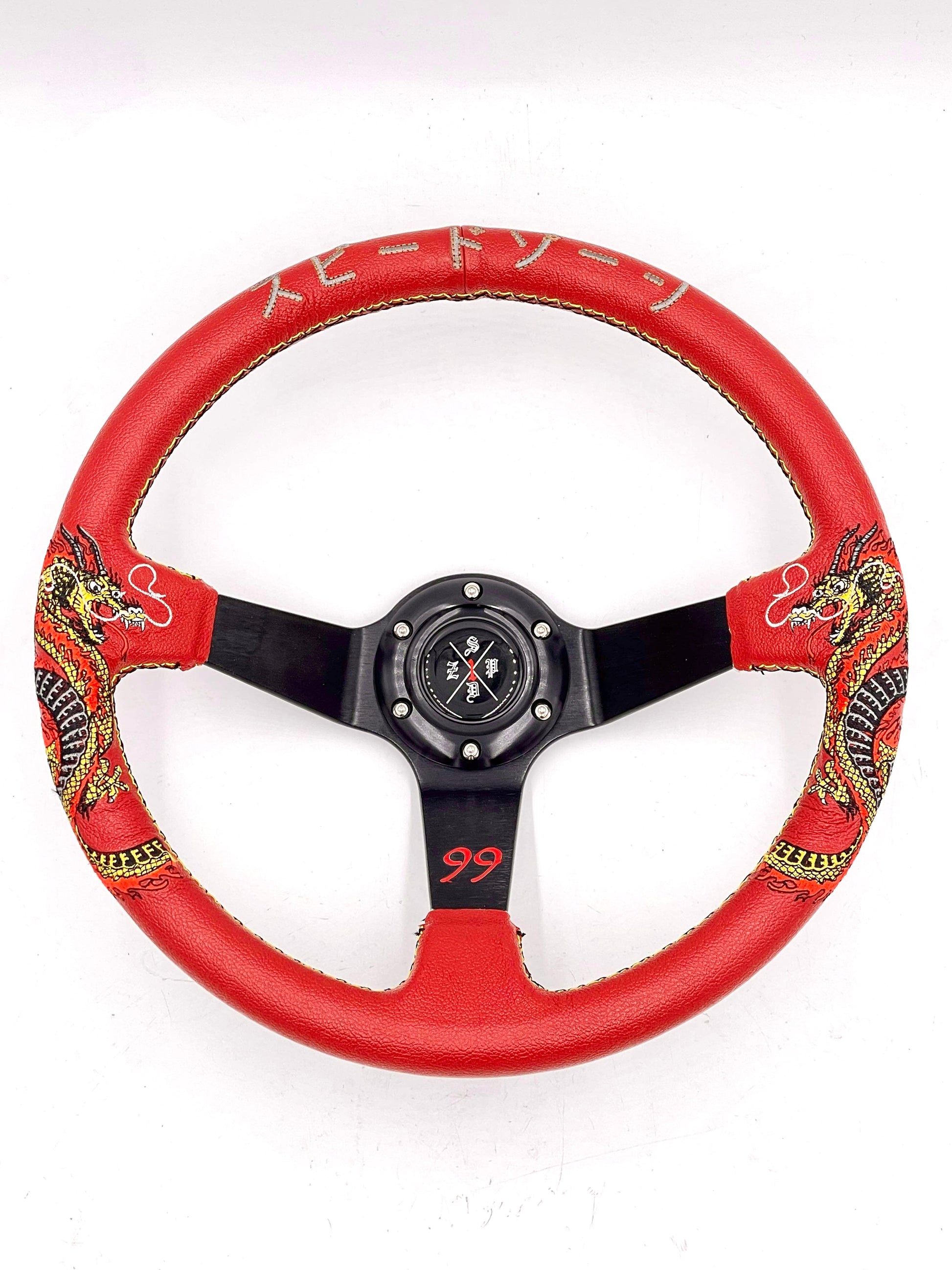 Red SPDZ1 “The Dragon” steering wheel by Speedzone Performance LLC, featuring a detailed dragon design for racing enthusiasts.