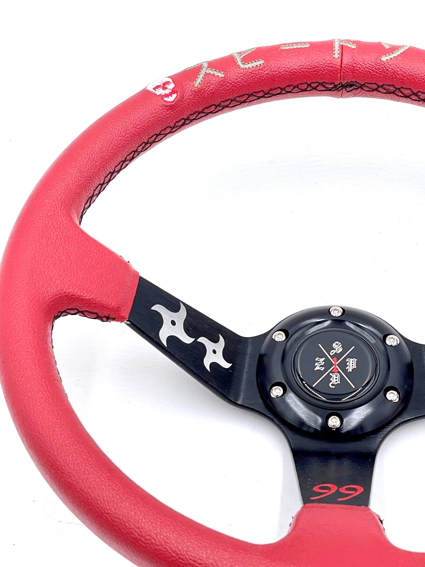 Red SPDZ1 “The Ninja” deep dish steering wheel by Speedzone Performance LLC, with a sleek, ergonomic design for racing vehicles.