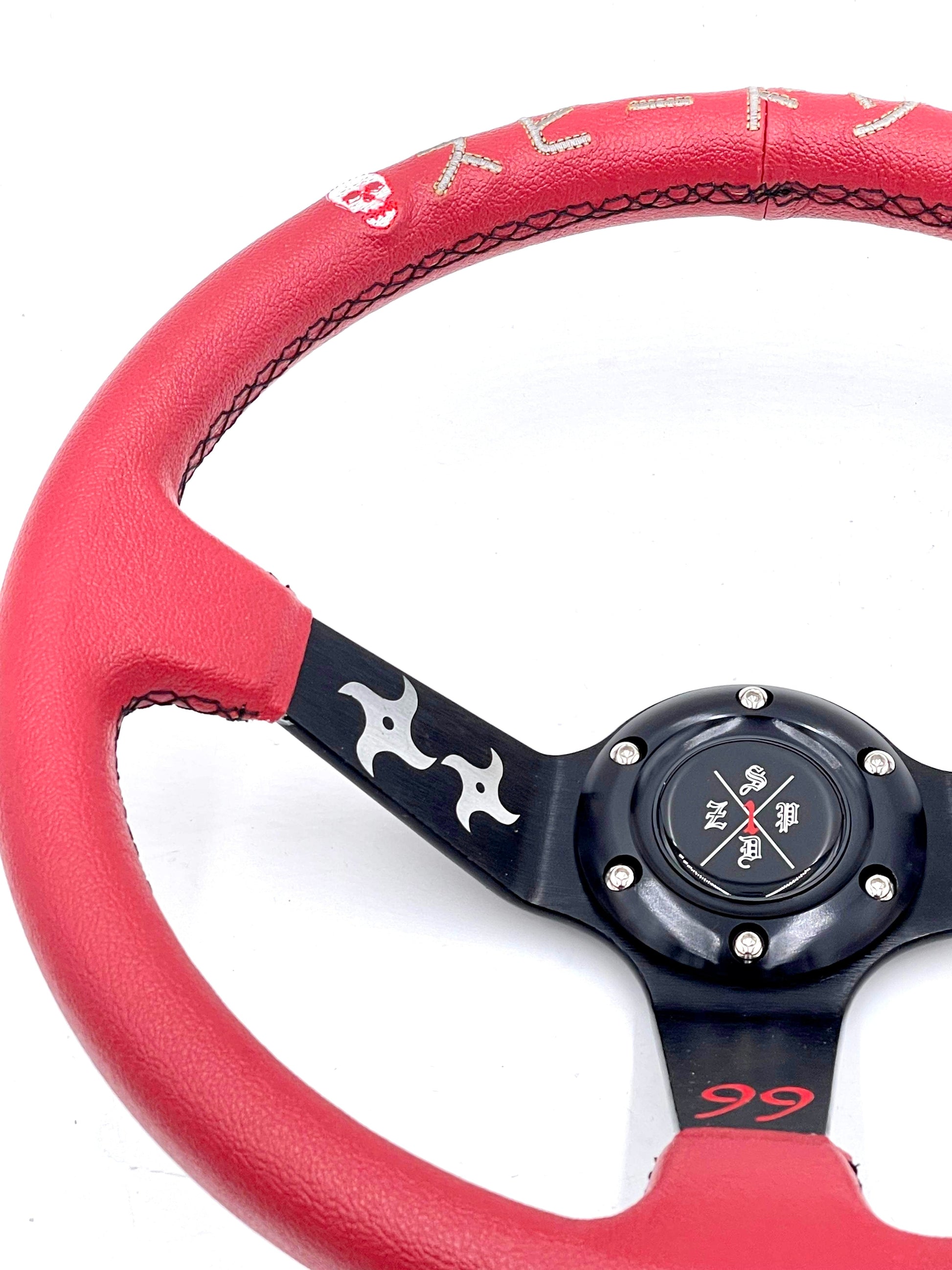 Red SPDZ1 “The Ninja” deep dish steering wheel by Speedzone Performance LLC, with a sleek, ergonomic design for racing vehicles.