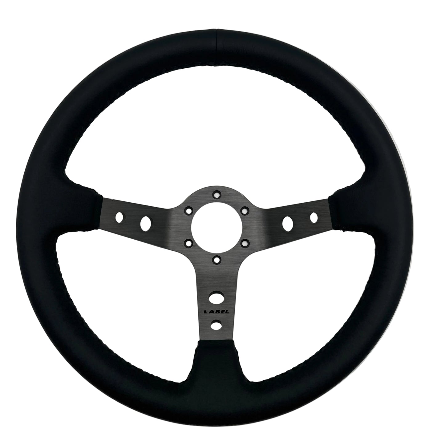Black leather Daytona steering wheel with graphite spoke and black stitching, designed for performance cars.