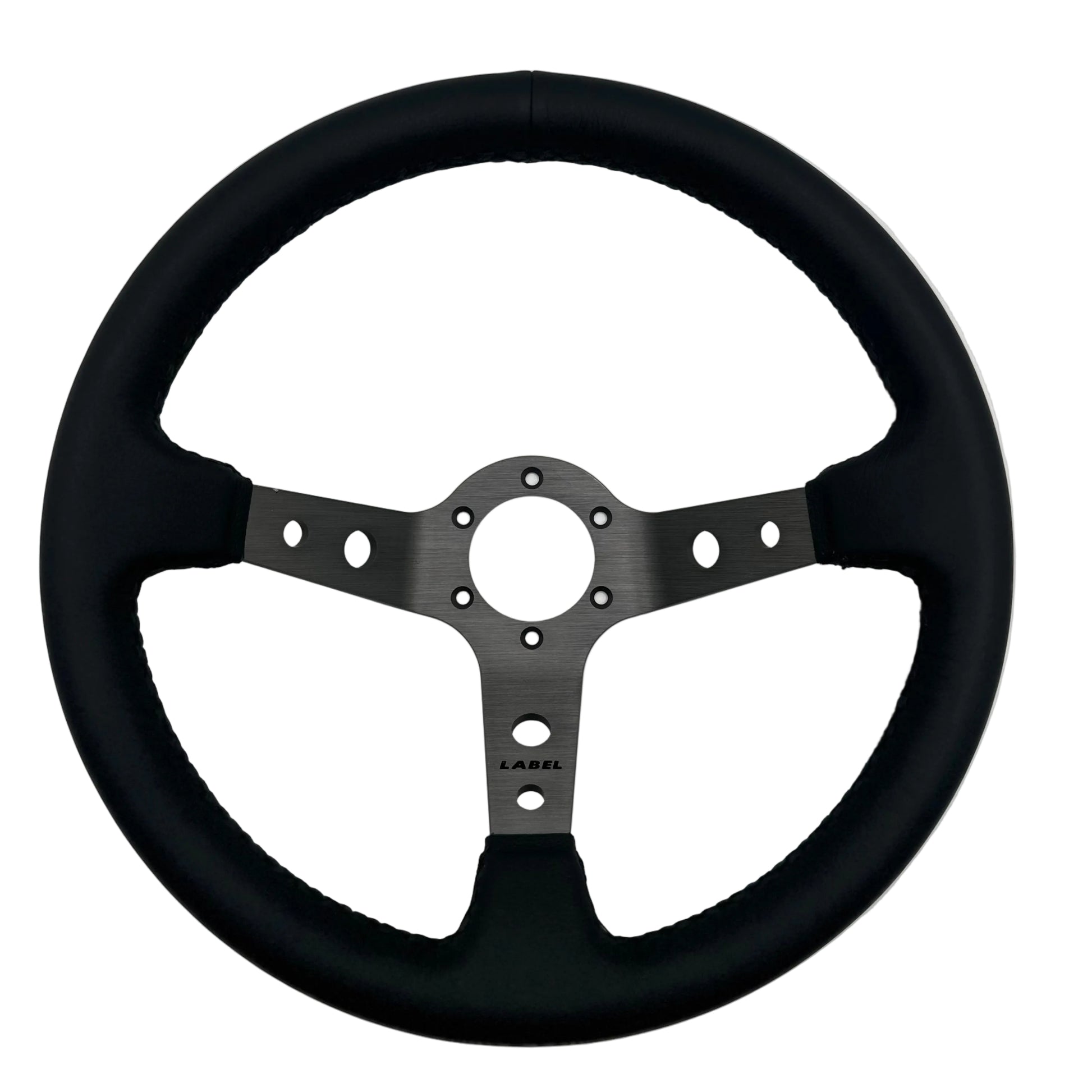 Black leather Daytona steering wheel with graphite spoke and black stitching, designed for performance cars.
