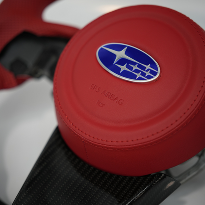 JDMuscle Subaru WRX Ultimate Series steering wheel compatible with manual and CVT transmissions, featuring a sporty design.