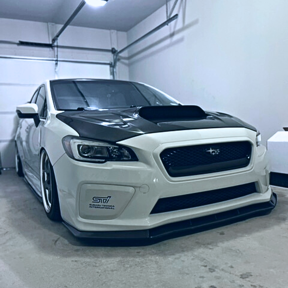 JDMuscle gloss black fog light covers with paint-matched accents for 2015-2017 Subaru WRX and STI models.