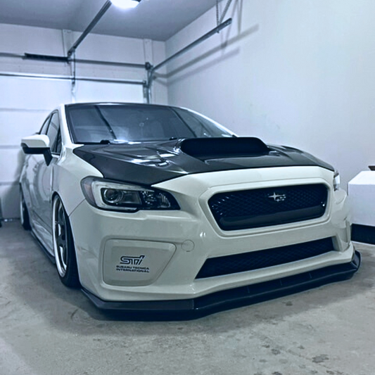 JDMuscle gloss black fog light covers with paint-matched accents for 2015-2017 Subaru WRX and STI models.