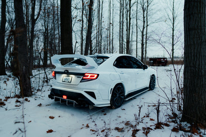 OLM Spec-AR LED taillights with clear lens, black base, and white bar on a 2022+ Subaru WRX, showing the tail light design.