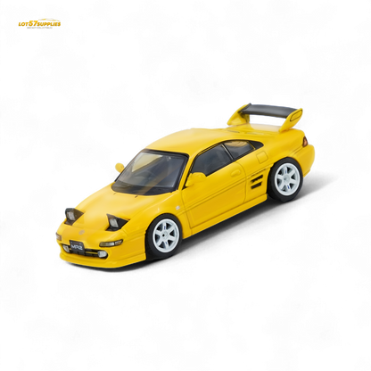 Yellow 1:64 scale Inno64 Toyota MR2 SW20 diecast model with detailed exterior, displayed on a plain background.