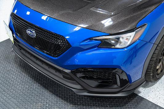 OLM S Style matte black front lip for 2022+ Subaru WRX, enhances the vehicle's sporty front end appearance.