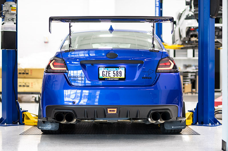 OLM Evolution Tail Lights for 2015-2021 Subaru WRX/STI, clear lens, black base, white bar, automotive rear lighting.
