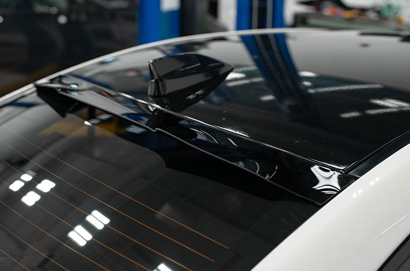 OLM V2 Rear Window Visor for 2015-2021 Subaru WRX/STI, showing sleek, aerodynamic design attached to the vehicle's rear window.