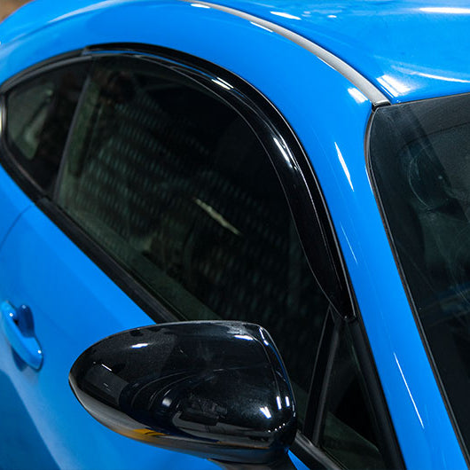 OLM V1 Style rain guards for 2022+ Subaru BRZ and Toyota GR86, black window deflectors installed alcove