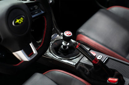 OLM Signature Series E-Brake Handle in red and black carbon for Subaru BRZ, WRX, and STI