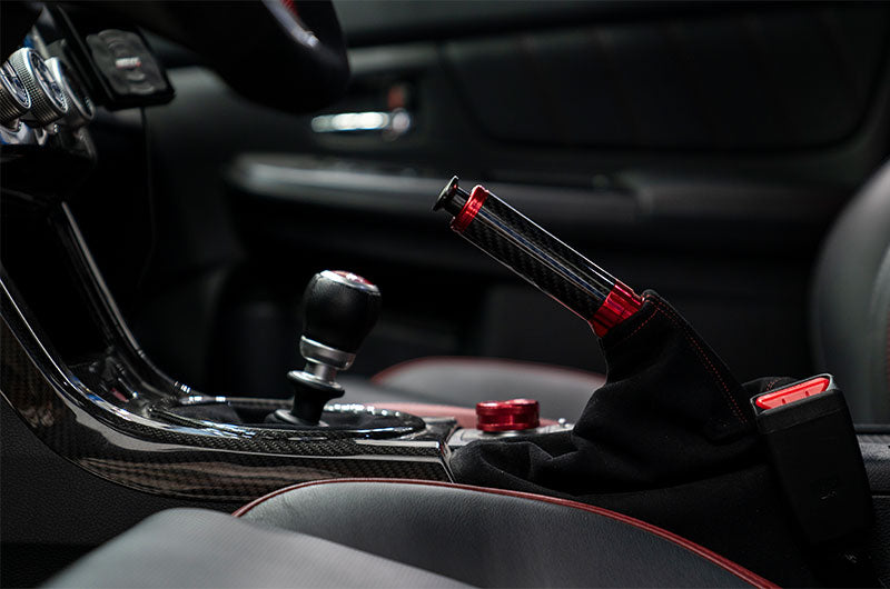 OLM Signature Series red and black carbon e-brake handle for BRZ, WRX, and STI
