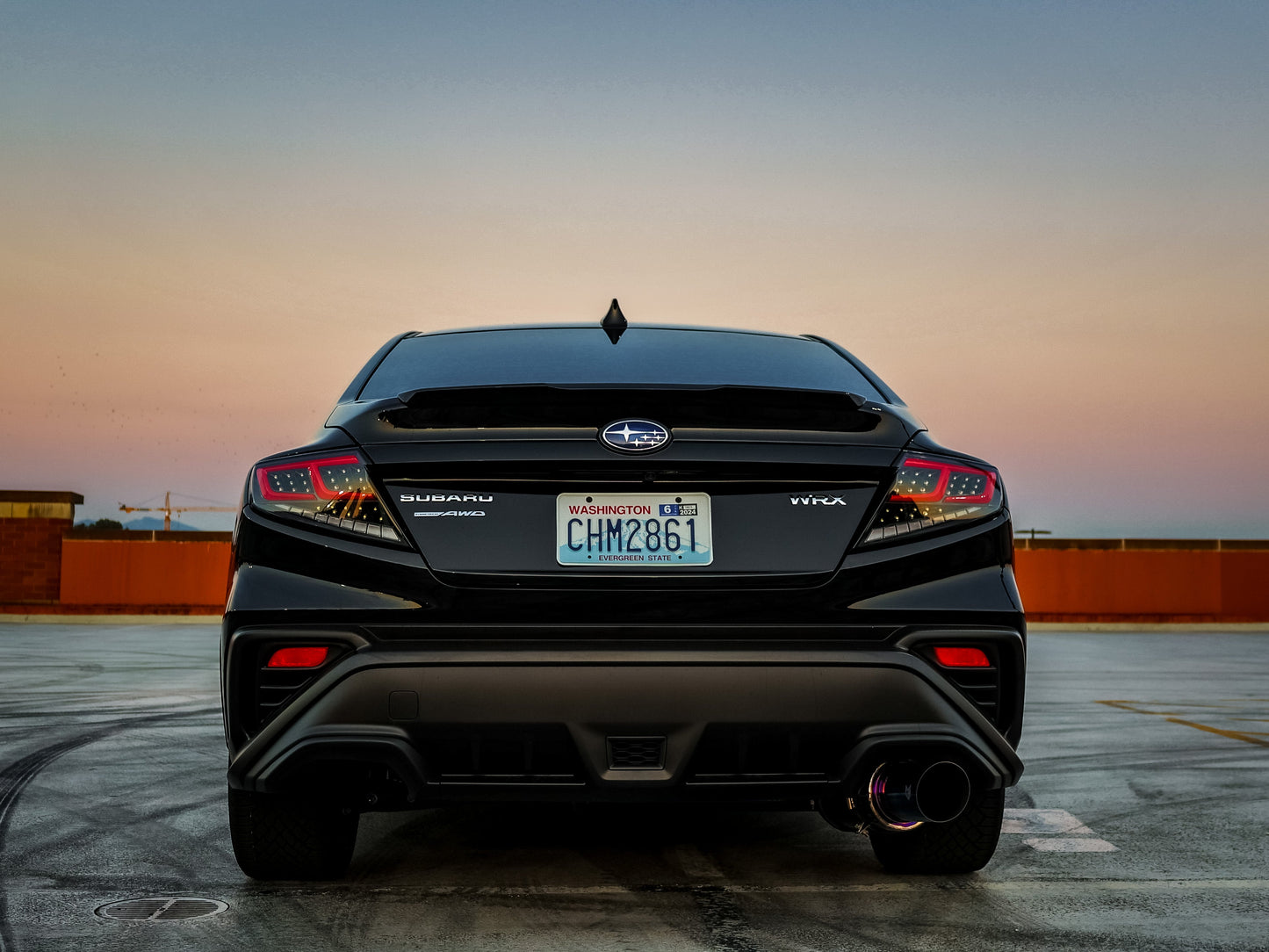 OLM Spec-AR LED taillights for 2022+ Subaru WRX, clear lens with black base and red bar, showing the sleek tail light design.