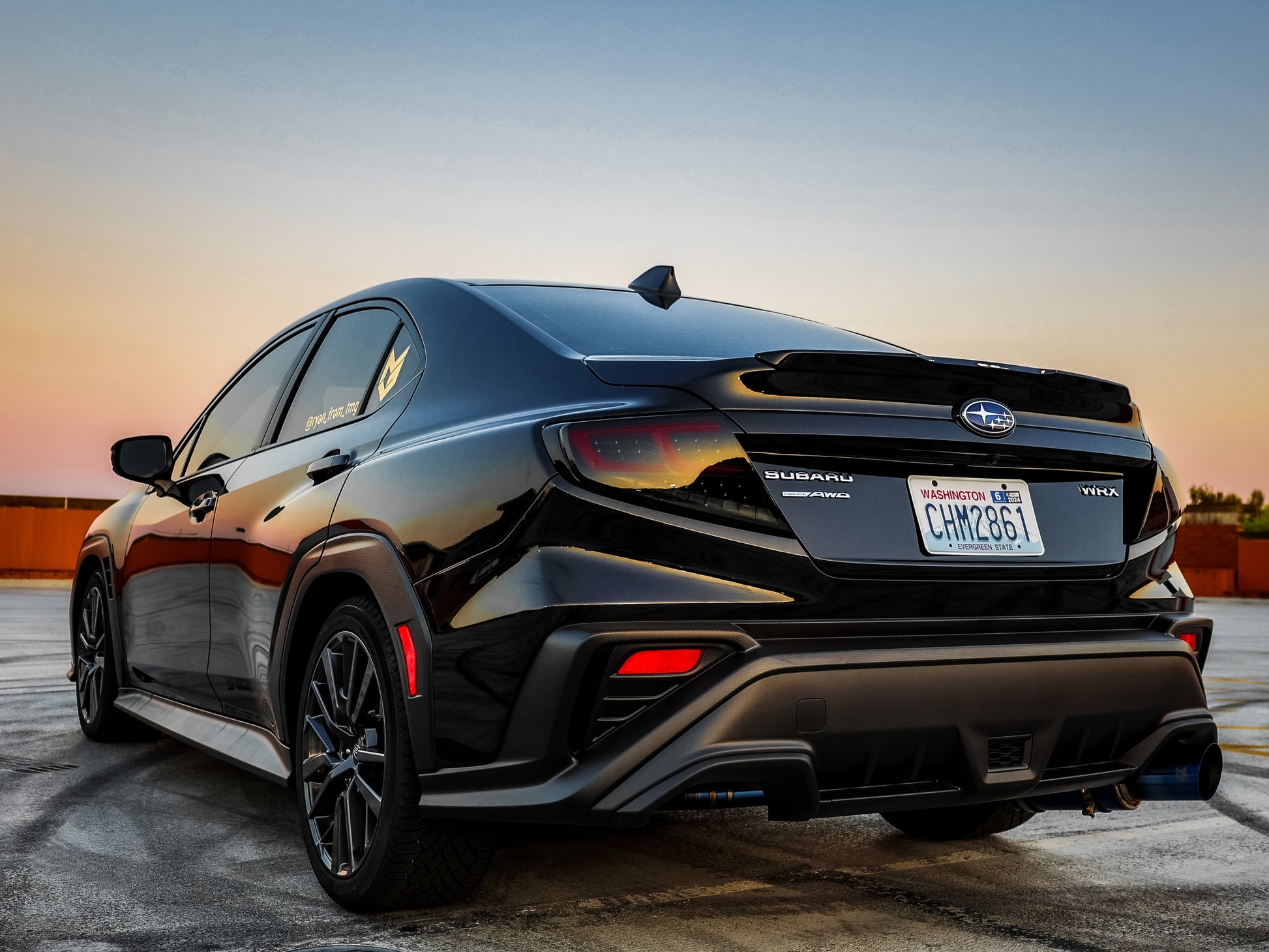 OLM Spec-AR LED taillights with smoke lens, black base, and red bar installed on a 2022+ Subaru WRX.