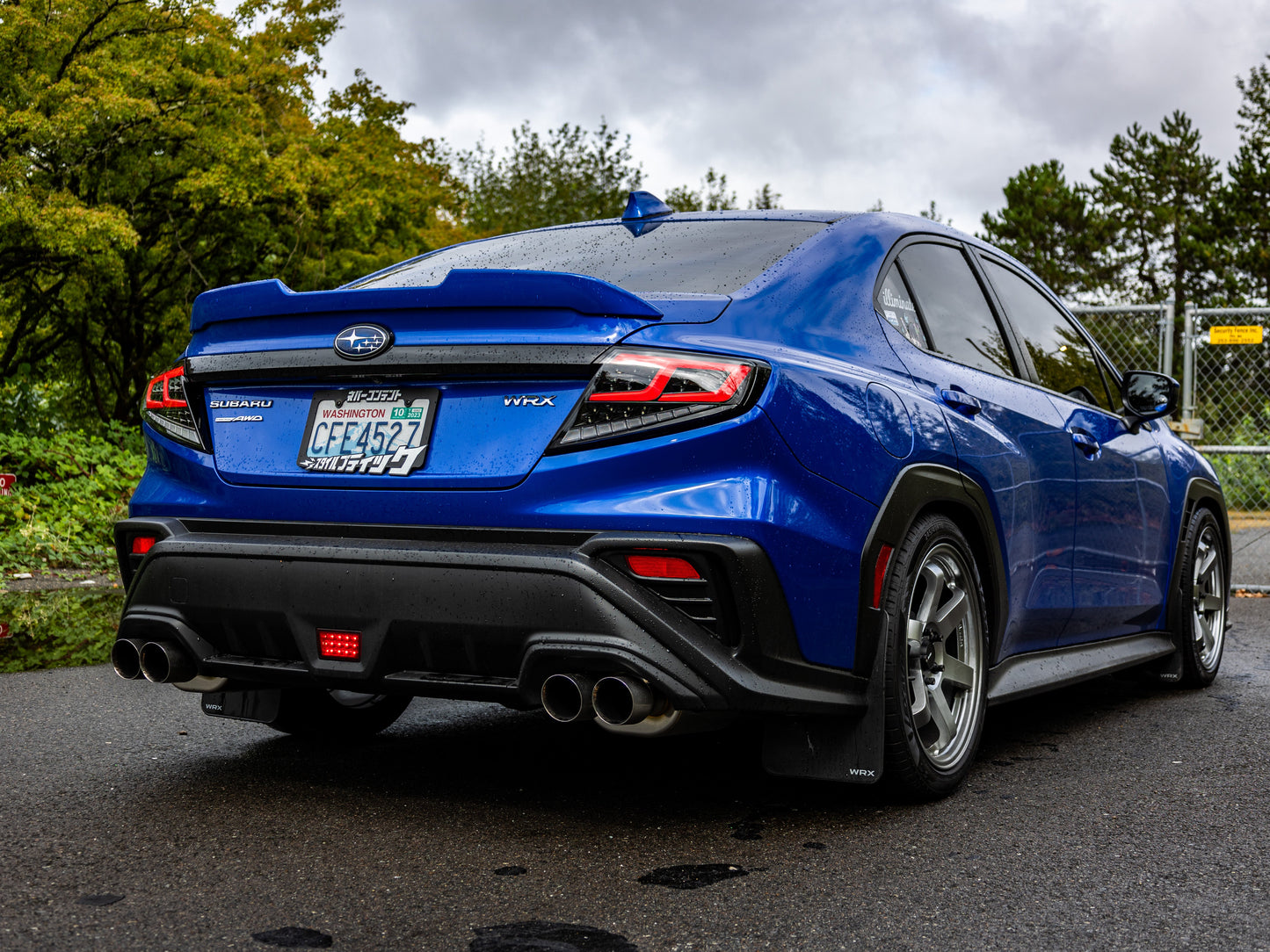 OLM Spec-AR LED taillights for 2022+ Subaru WRX, clear lens with black base and red bar, shown on vehicle.