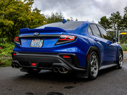 OLM Spec-AR LED taillights for 2022+ Subaru WRX, clear lens with black base and red bar, shown on vehicle.