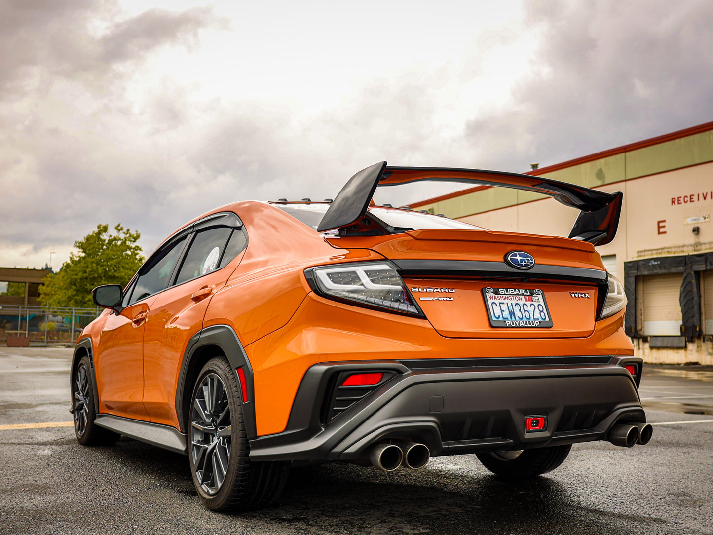 OLM Spec-AR LED taillights for 2022+ Subaru WRX with clear lens, black base, and white bar, shown in a close-up view.