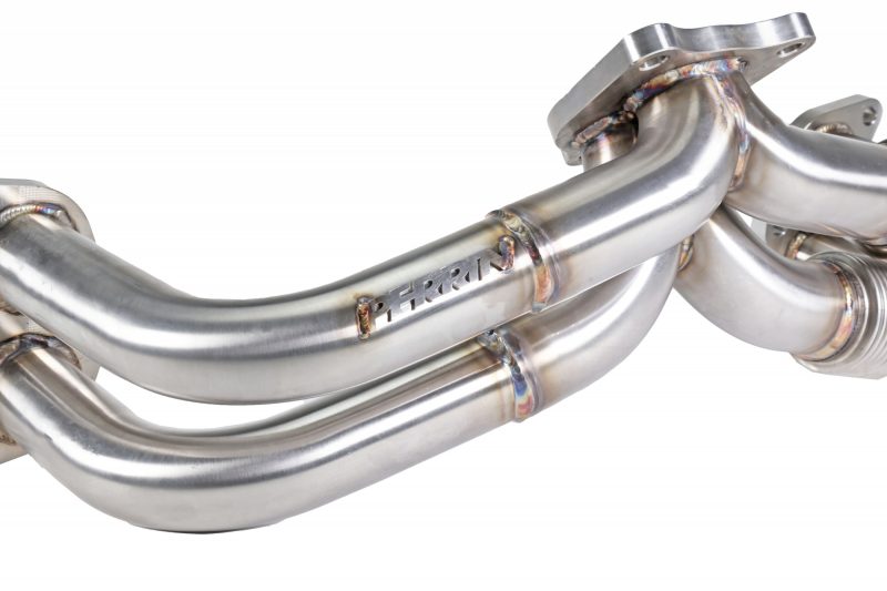 JDMuscle Perrin 19-25 WRX equal length brushed stainless steel exhaust headers, close-up of polished header pipes.