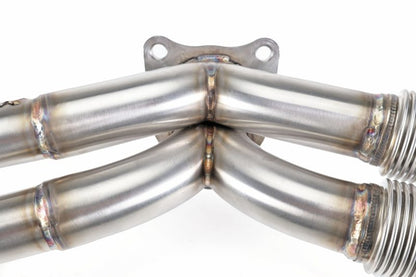 Brushed stainless steel Perrin 19-25 WRX equal length exhaust headers with smooth welds for improved performance.