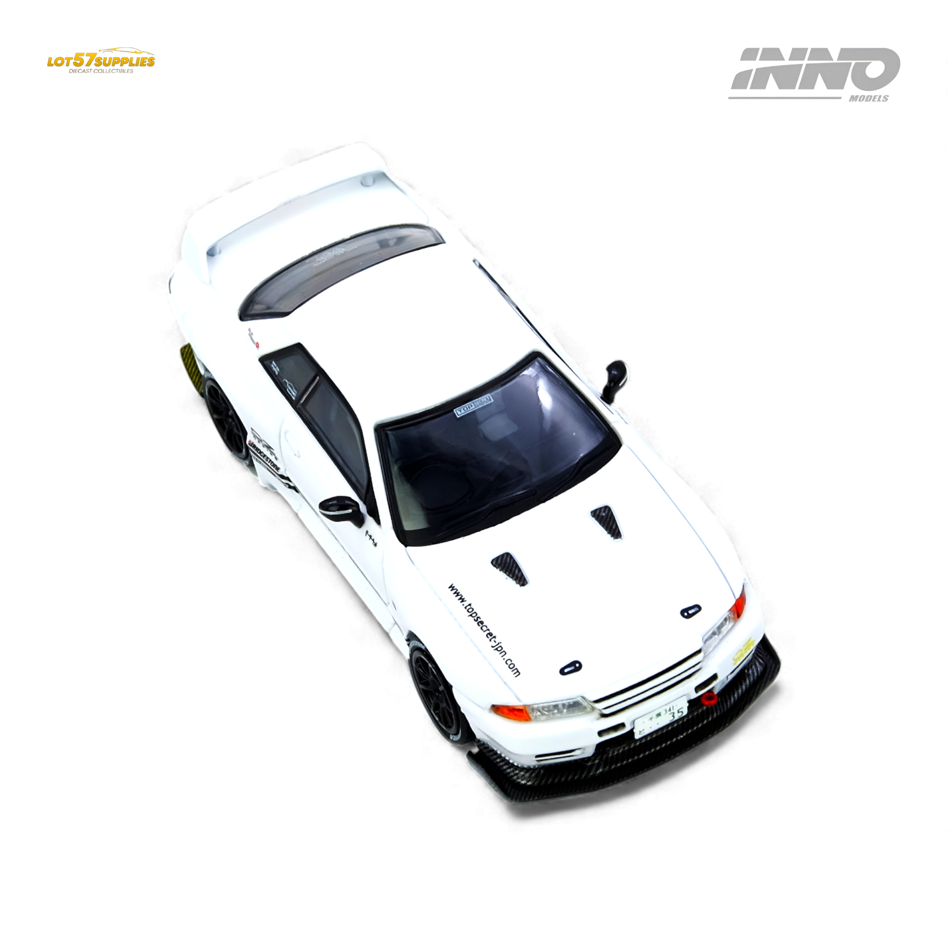 White INNO64 Top Secret VR32 Nissan GT-R diecast model, detailed 1:64 scale collectible with realistic design.