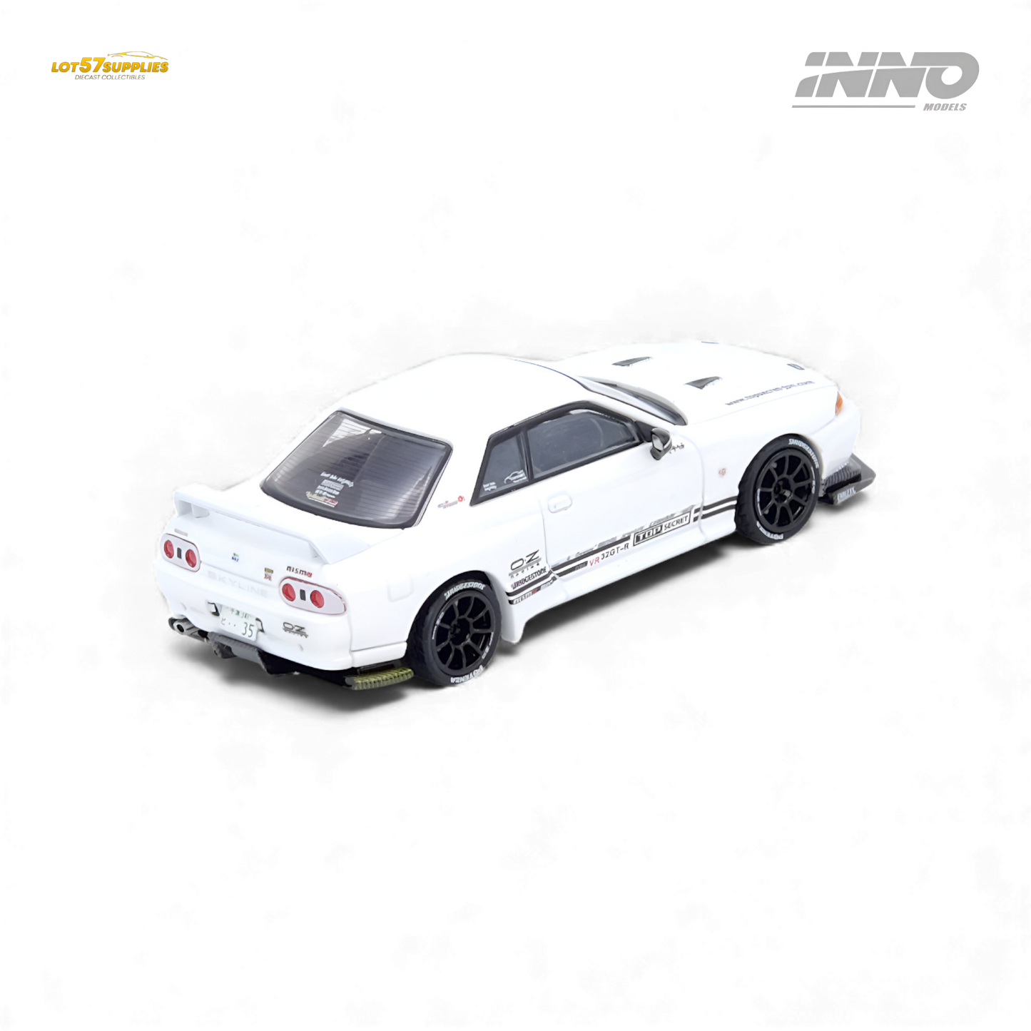 White INNO64 Top Secret VR32 Nissan GT-R diecast model, 1:64 scale, detailed replica with visible roof and side design.