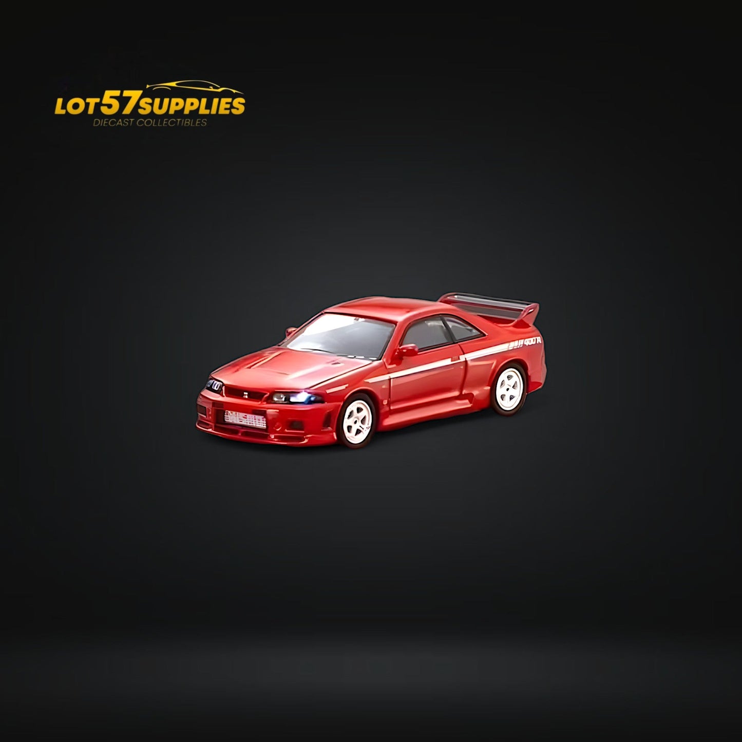 Red Kyosho Nismo 400R R33 Nissan diecast car in 1:64 scale, showcasing detailed exterior and vibrant red finish.
