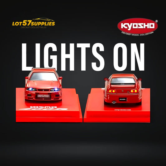 Red Kyosho Nismo 400R R33 diecast model car in 1:64 scale, detailed Nissan vehicle with red finish, shown from side angle