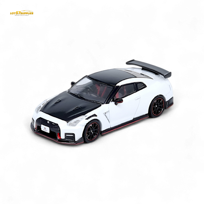 White Inno64 Nissan GT-R R35 NISMO diecast model, detailed 1:64 scale car showcasing sleek design and NISMO branding.