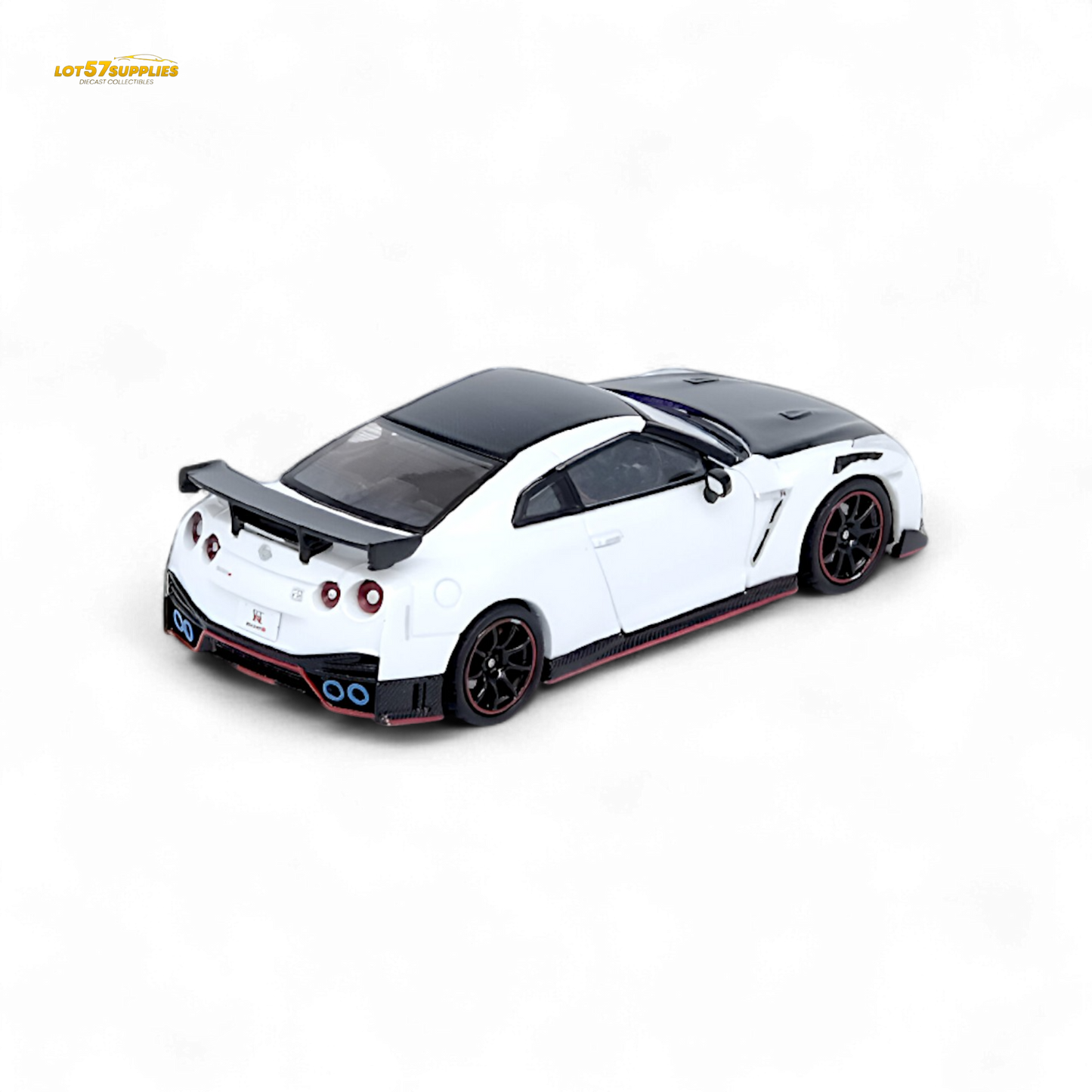 White Inno64 Nissan GT-R R35 NISMO diecast model, detailed miniature car on display with visible features and branding.
