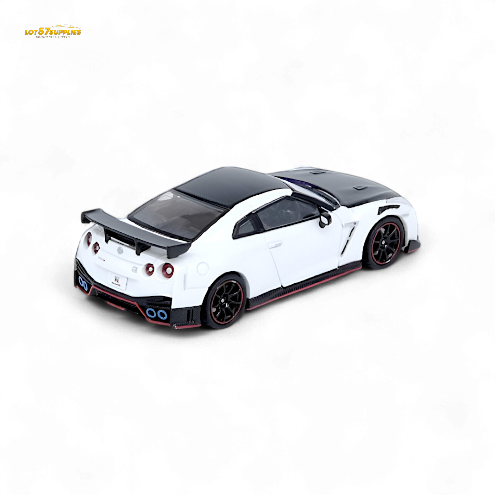 White Inno64 Nissan GT-R R35 NISMO diecast model, detailed miniature car on display with visible features and branding.
