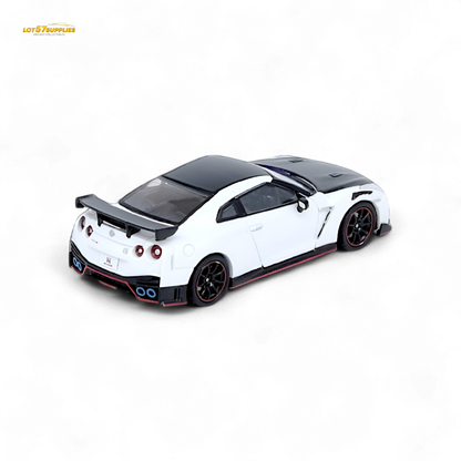 White Inno64 Nissan GT-R R35 NISMO diecast model, detailed miniature car on display with visible features and branding.