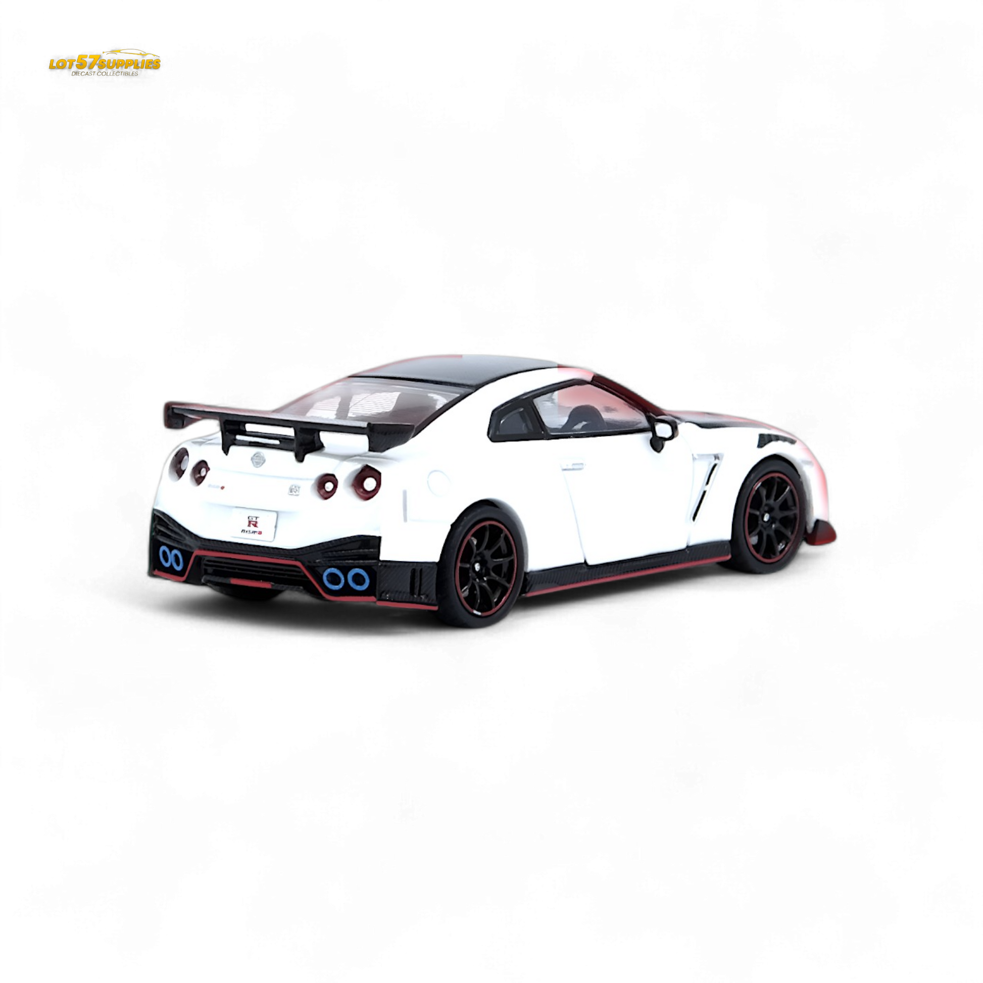 White Inno64 Nissan GT-R R35 NISMO diecast model in 1:64 scale, detailed view of the Nissan sports car.