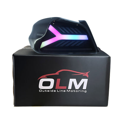 OLM Y-Spec LED taillights for 2015-2021 Subaru WRX/STI with smoke lens and RGB optic, shown in packaging.