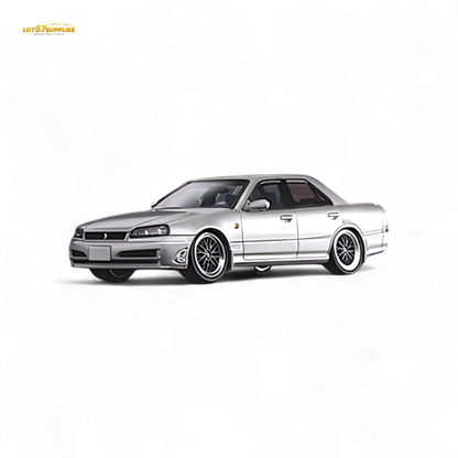 Silver Nissan ER34 Skyline 1:64 diecast model by Lot57Supplies, showing detailed exterior view of the miniature car.