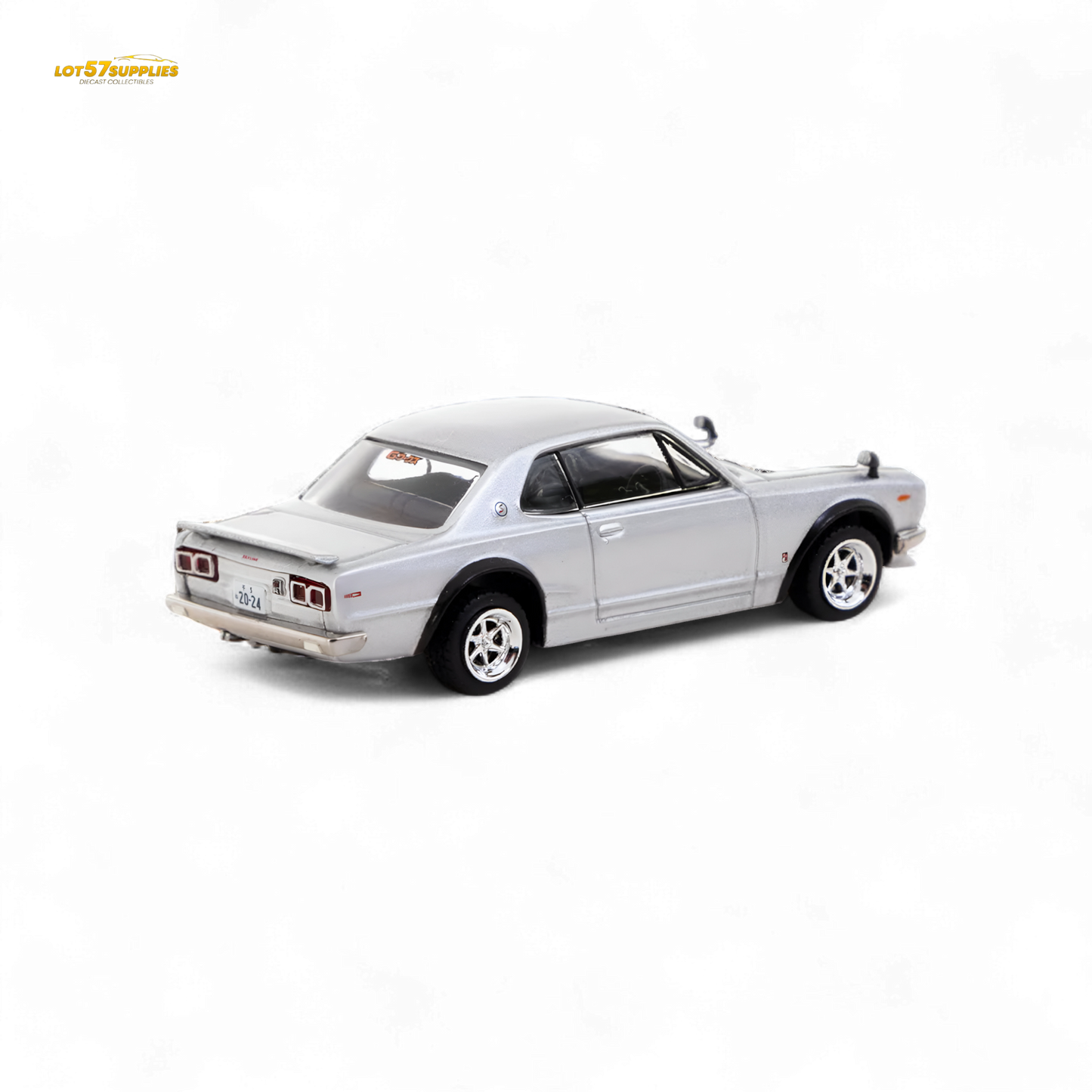 Silver Tarmac Works Nissan Skyline 2000 GT-R diecast model in 1:64 scale, showcasing detailed exterior and authentic design.