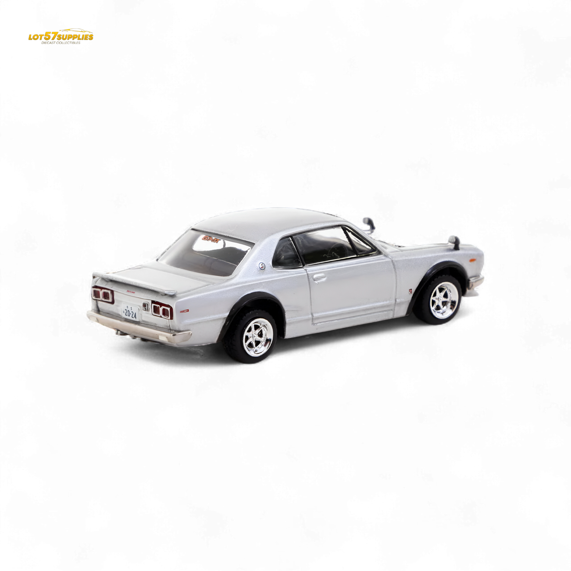 Silver Tarmac Works Nissan Skyline 2000 GT-R diecast model in 1:64 scale, showcasing detailed exterior and authentic design.