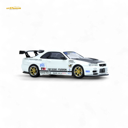 White Inno64 Top Secret R34 GT-R diecast car, 1:64 scale Nissan model with detailed exterior, on a plain background