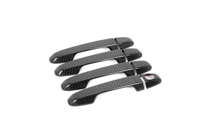OLM carbon fiber door handle covers for 2022 WRX base and premium trim, exterior car door handle upgrade with sleek carbon fiber finish.