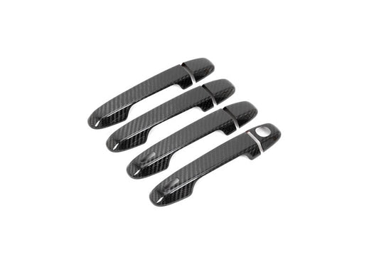 OLM carbon fiber door handle covers on a 2022 Subaru WRX GT and Limited trim, exterior trim with sleek carbon fiber finish.
